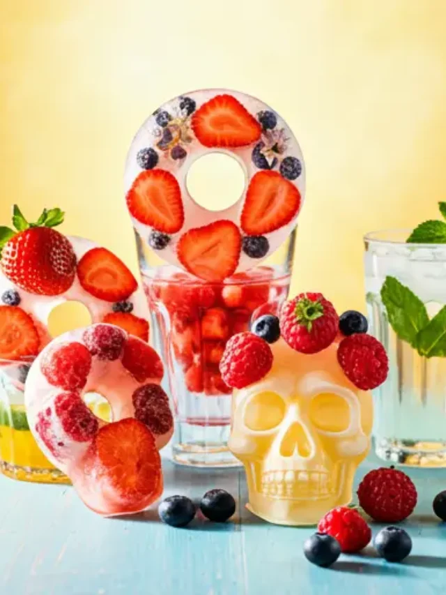 A set of Floral Fruit Ice Rings, featuring frozen slices of citrus, berries, and edible flowers encased in crystal-clear ice, perfect for elevating any summer beverage.