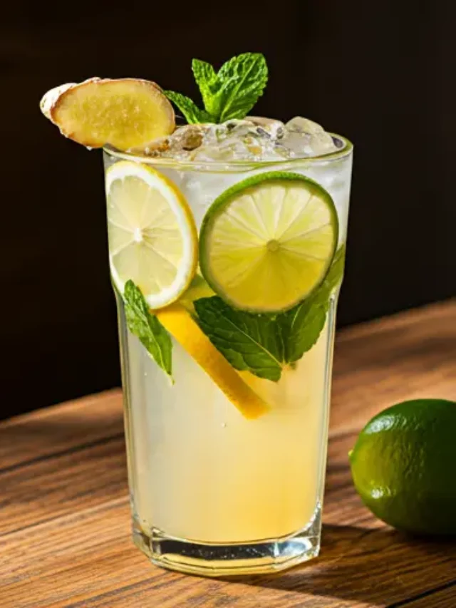 A zesty citrus and ginger elixir in a glass, garnished with lemon slices and a twist of fresh ginger, exuding a refreshing and energizing vibe.
