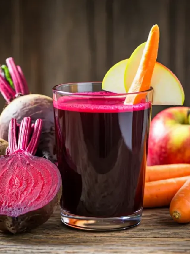 Beetroot Symphony : A vibrant red-purple juice in a glass, garnished with a beet slice and a sprig of mint, exuding earthy richness and vibrancy.