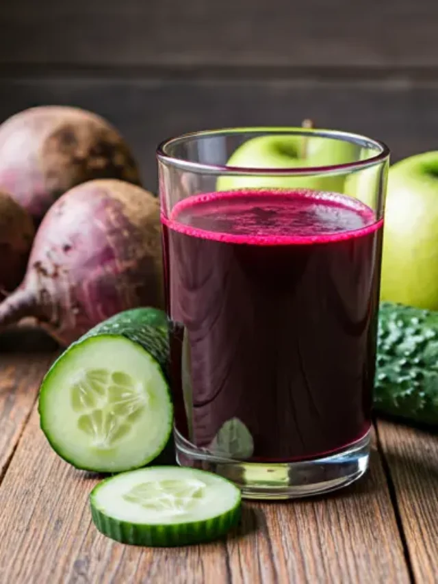 Crimson Delight A vibrant red juice served in a glass, garnished with fresh pomegranate seeds and a sprig of mint, radiating bold and fruity freshness.