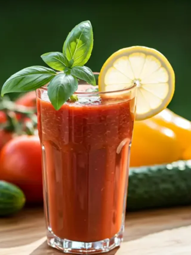 A vibrant glass of Crimson Zest Elixir, glowing with a rich red hue, garnished with a slice of blood orange and a sprig of rosemary.