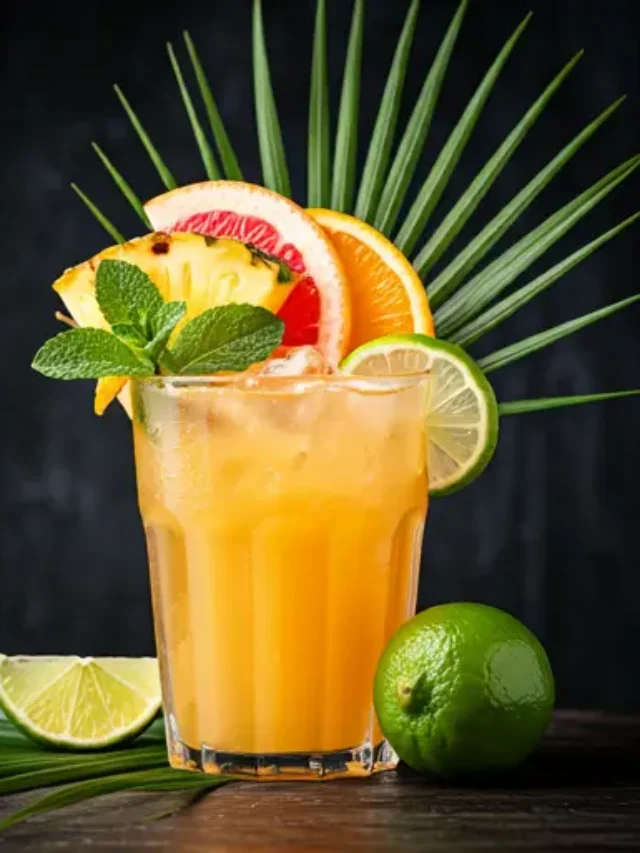 Sun-Kissed Citrus Paradise : A bright orange juice in a glass, garnished with a slice of orange and a sprig of mint, radiating tropical warmth and zest.