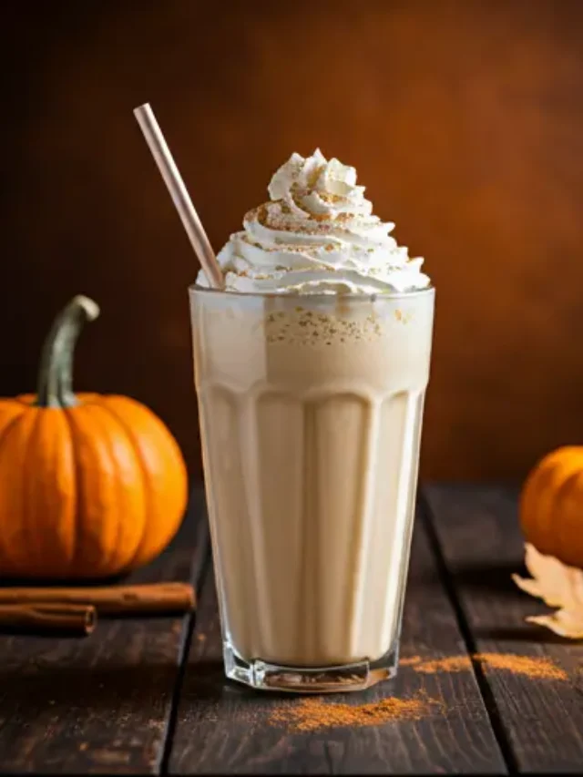 Autumn Bliss Pumpkin Milkshake : A creamy orange pumpkin milkshake in a glass, topped with whipped cream and a sprinkle of nutmeg, exuding cozy autumn vibes.
