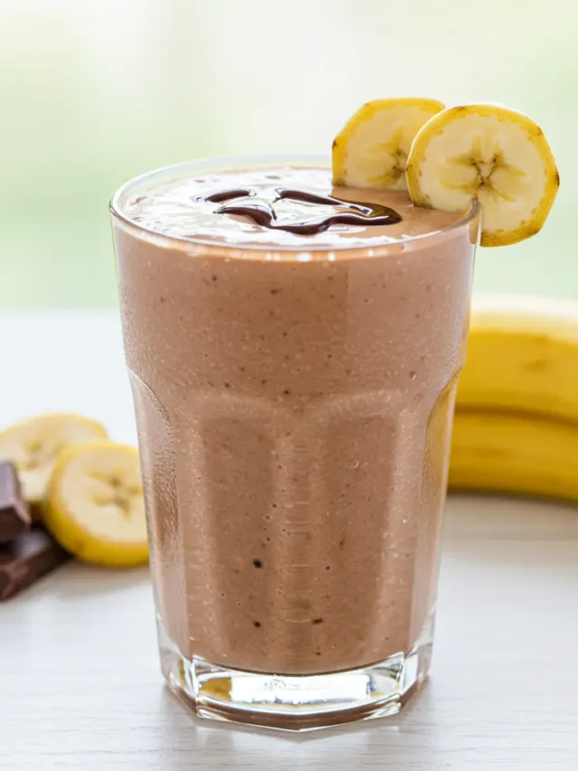 Chocolate Dream Smoothie in a blender with chocolate chunks, bananas, and creamy milk.