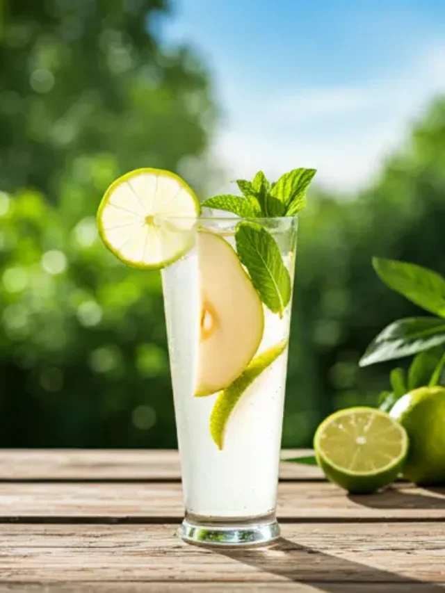 Crisp Asian Pear Sparkler : A light golden drink in a glass, garnished with a slice of Asian pear and a sprig of rosemary, exuding crisp and elegant refreshment.