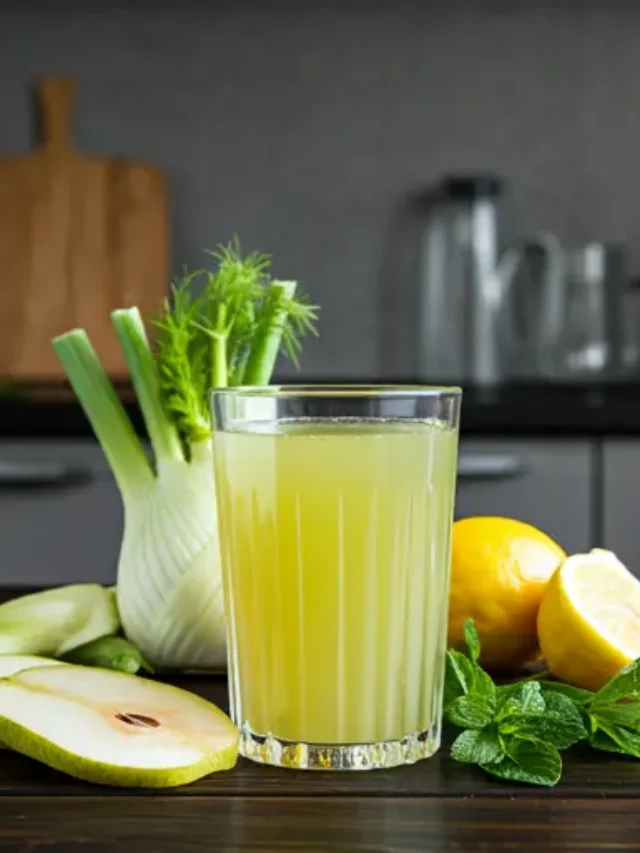 Pear & Fennel Vitality Juice : A light green juice in a glass, garnished with a thin slice of pear and a fennel frond, exuding fresh and crisp vitality.