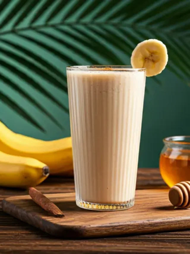 Tropical Banana Dream : A creamy tropical banana smoothie in a glass, topped with banana slices and a sprinkle of coconut flakes.