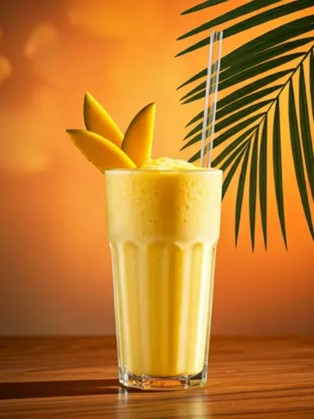 Golden Mango Milkshake : A rich and creamy mango milkshake in a tall glass, garnished with fresh mango slices.