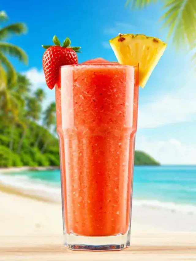 Refreshing Strawberry Pineapple Bliss : A vibrant pink smoothie in a glass, garnished with fresh strawberry slices and a pineapple wedge.